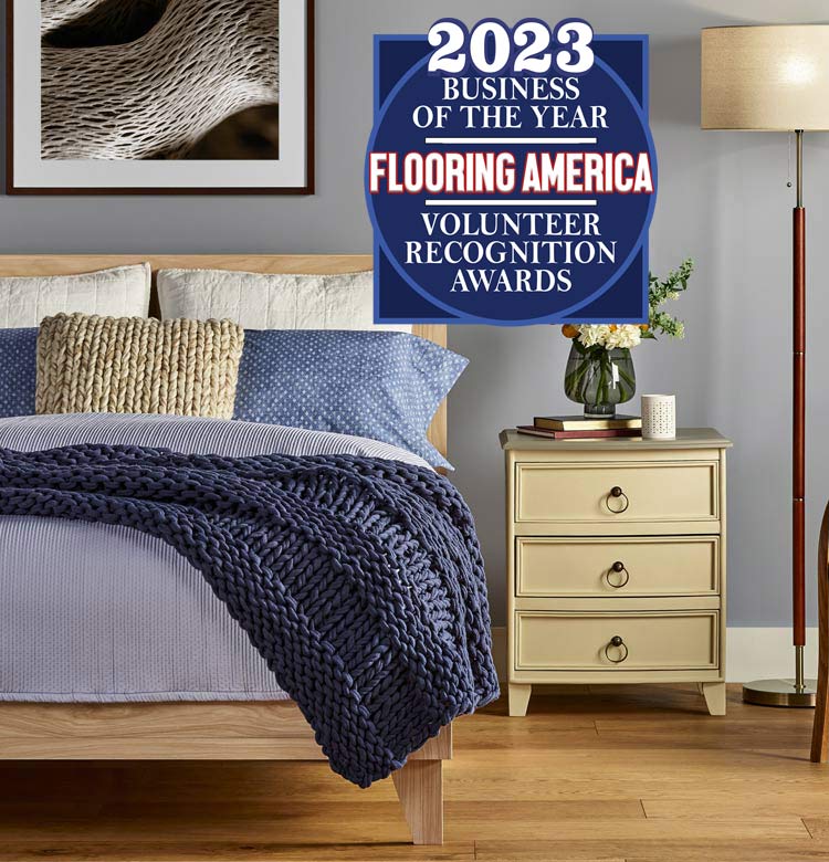 Bedroom with new oak hardwood flooring from Flooring America