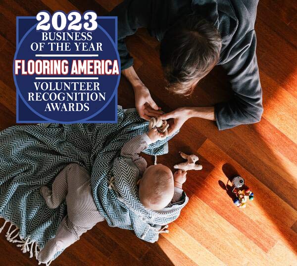 Mother and baby playing on a hardwood floor