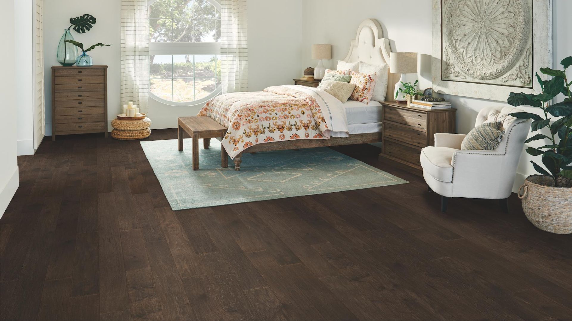 dark stained hardwood flooring in a bright bedroom